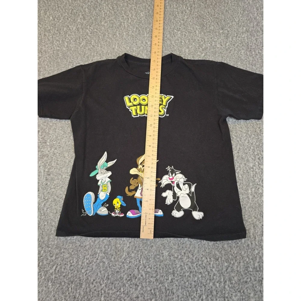 black Looney Tunes t-shirt features a graphic of Bugs Bunny, Wile E. Coyote,...